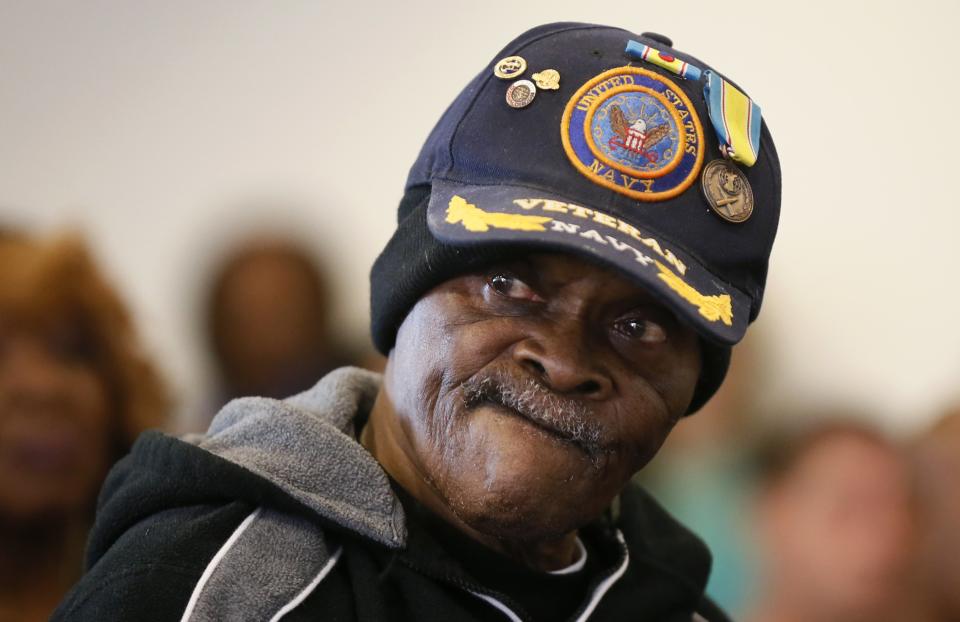 U.S. navy veteran Curtiss Brown listens during a Veterans Day observance for homeless veterans at The Midnight Mission shelter on skid row in Los Angeles