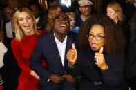 CORRECTS KARLIE'S LAST NAME TO KLOSS FROM KLOOS - Model Karlie Kloss, left, and British Vogue magazine chief editor Edward Enninful, center, and Oprah Winfrey joke before the presentation of Stella McCartney's ready-to-wear Fall-Winter 2019-2020 fashion collection, Monday, March 4, 2019, in Paris. (AP Photo/Michel Euler)