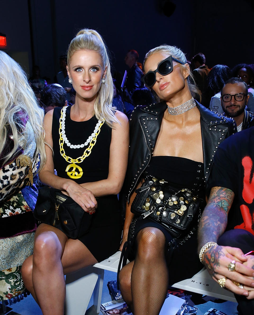 Nicky and Paris Hilton at Jeremy Scott. (Photo: Getty)