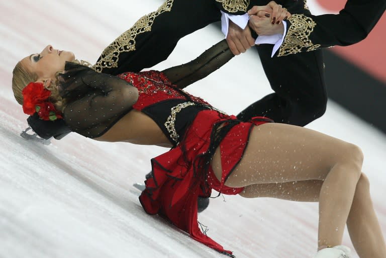 Tatiana Navka and Roman Kostomarov perform at the 2006 Winter Olympics in Turin