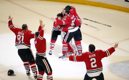 Modern-day dynasty: Members of the Blackhawks celebrate moments after defeating the Lightning. (AP)