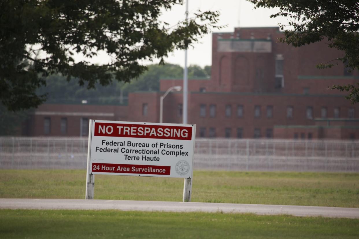 View of a sign outside the Terre Haute Federal Correctional...