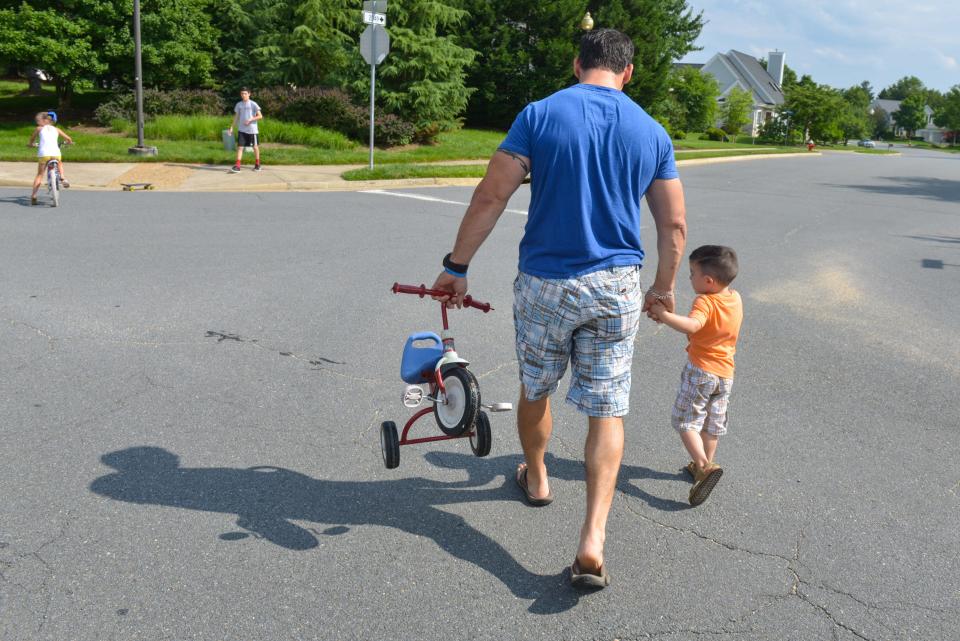 A father with his son near their home in Ashburn, Virginia, in June 2014.