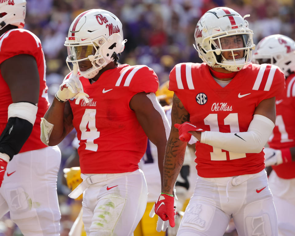 Oct 22, 2022; Baton Rouge, Louisiana; Mississippi Rebels running back Quinshon Judkins (4) and Mississippi Rebels wide receiver Jordan Watkins (11) react to a making a touchdown against the LSU Tigers during the first half at Tiger Stadium. Stephen Lew-USA TODAY Sports