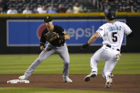 Pittsburgh Pirates second baseman Kevin Newman forces out Arizona Diamondbacks' Alek Thomas (5) on a ball hit by Ketel Marte during the first inning of a baseball game Tuesday, Aug. 9, 2022, in Phoenix. (AP Photo/Rick Scuteri)