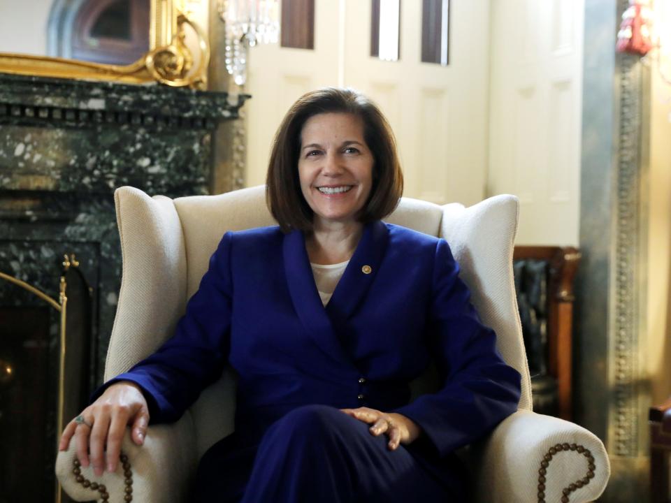 Catherine Cortez Masto sits in an armchair