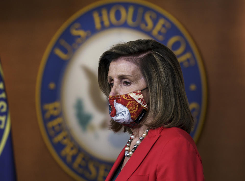 FILE - In this Nov. 6, 2020, file photo Speaker of the House Nancy Pelosi, D-Calif., pauses as she meets with reporters about the impact of the election on the political landscape in Congress, at the Capitol in Washington. President Donald Trump lost the presidency and Democrat Joe Biden will move into the White House in January after winning nearly 80 million votes nationwide, a historic high. But the enthusiasm for Biden, or for removing Trump, didn't trickle down to other Democrats down ballot. That leaves the party confronting a reckoning over how to move forward. The Democratic Congressional Campaign Committee is beginning a “deep dive” examination into what happened. (AP Photo/J. Scott Applewhite, File)