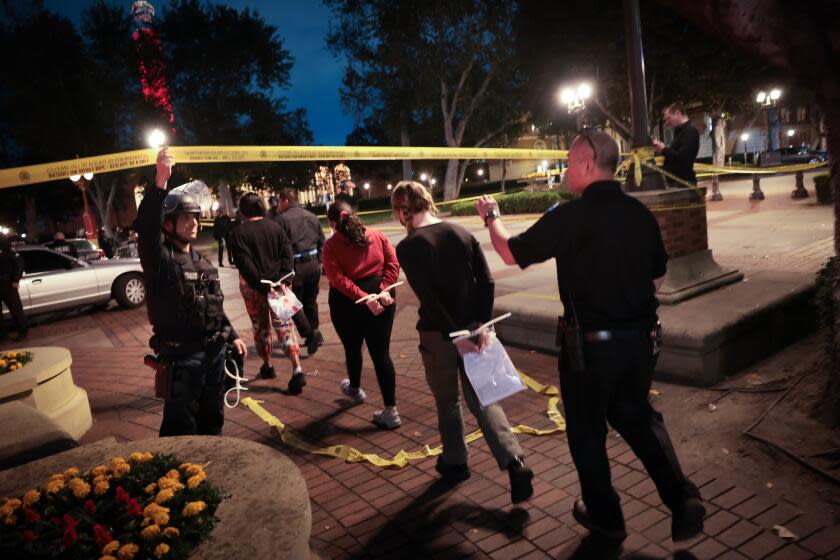 Los Angeles, CA - April 24: Students are apprehended by Los Angeles police officers after a protest against the Israel-Palestinian war at the University of Southern California on Wednesday, April 24, 2024 in Los Angeles, CA.(Wally Skalij / Los Angeles Times)