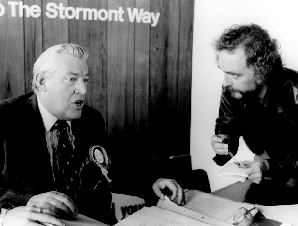 FILE - In this Oct. 1982 file photo, AP Correspondent Ed Blanche, right, interviews Reverend Ian Paisley, Member of Parliament, leader of Ulster's Democratic Unionist Party in Belfast, Northern Ireland. Family members say Ed Blanche, a longtime correspondent and Middle East editor for The Associated Press who covered transformative events from Northern Ireland to Lebanon, has died. He was 76, it was reported on Tuesday, Jan. 15, 2019. (AP Photo/Corporate Archives, File)