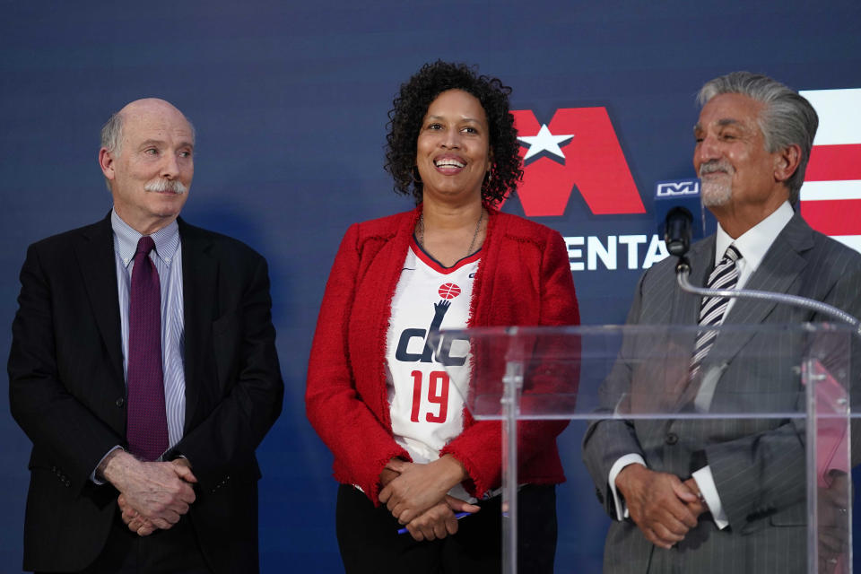 Ted Leonsis, right, owner of the Washington Wizards NBA basketball team and Washington Capitals NHL hockey team with Washington DC Mayor Muriel Bowser, center, and DC Council Chairman Phil Mendelson, left, during a news conference at Capitol One Arena in Washington, Wednesday, March 27, 2024. (AP Photo/Stephanie Scarbrough)