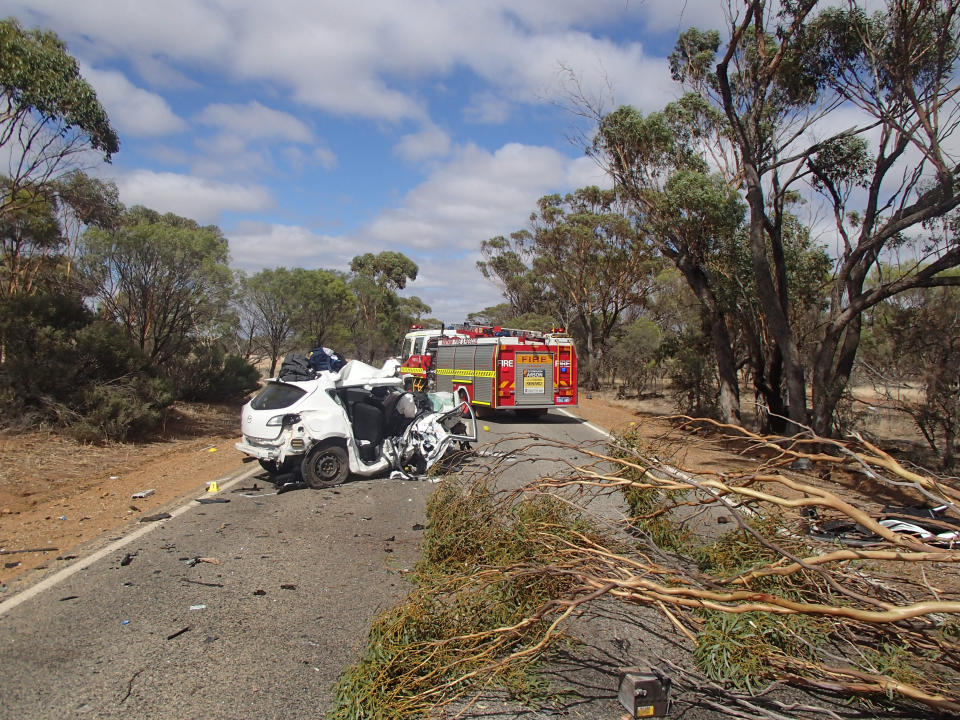 Road in WA with single vehicle wreck after crash that killed one person and injured another. 