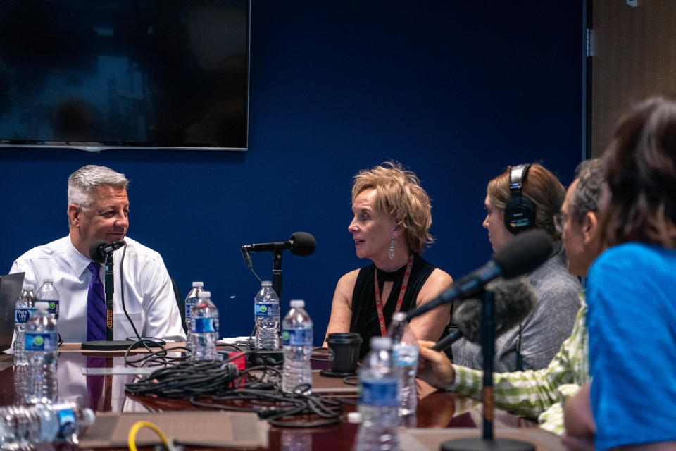 The Arizona Republic's Ronald J. Hansen, left, and Mary Jo Pitzl, middle, hosts of the Gaggle podcast, record an episode of the Gaggle with Republic reporters at the newsroom in Phoenix on Dec. 15, 2022.