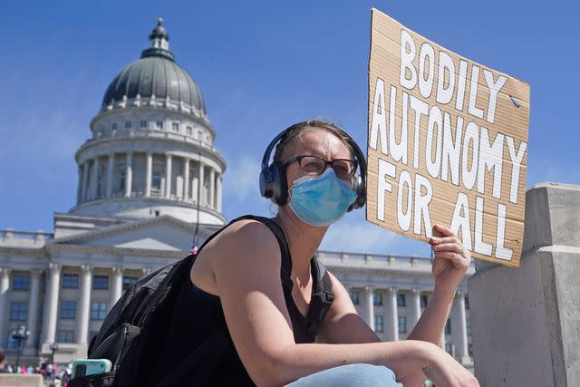Rick Bowmer/AP/Shutterstock A women protesting for abortion rights outside of the Utah State Capitol