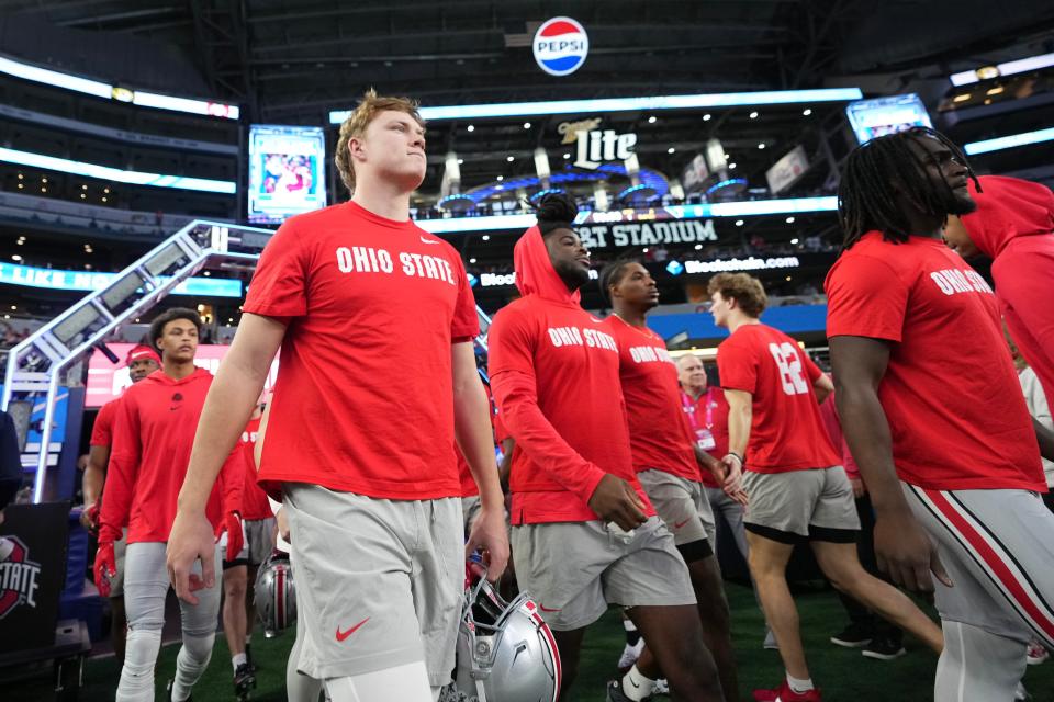 Dec 29, 2023; Arlington, Texas, USA; Ohio State Buckeyes quarterback Devin Brown (33) takes the field for warm-ups prior to the Goodyear Cotton Bowl Classic against the Missouri Tigers at AT&T Stadium.