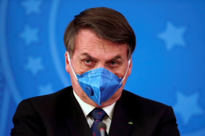 FILE PHOTO: FILE PHOTO: Brazil's President Jair Bolsonaro is pictured at a press briefing in Brasilia, Brazil, March 20, 2020.