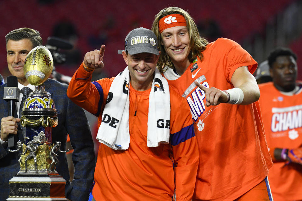 GLENDALE, AZ - DECEMBER 28: Clemson Tigers head coach Dabo Swinney and Clemson Tigers quarterback Trevor Lawrence (16) pose for a picture with the trophy after the 2019 PlayStation Fiesta Bowl college football playoff semifinal game between the Ohio State Buckeyes and the Clemson Tigers on December 28, 2019 at State Farm Stadium in Glendale, AZ. (Photo by Brian Rothmuller/Icon Sportswire via Getty Images)