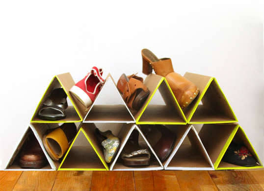 <p>If your current shoe storage solution is all tied up in knots, gather cardboard shipping boxes and try this zero-dollar geometric <a href="http://www.bobvila.com/slideshow/8-smart-shoe-racks-you-can-make-today-47949" rel="nofollow noopener" target="_blank" data-ylk="slk:shoe rack;elm:context_link;itc:0;sec:content-canvas" class="link ">shoe rack</a> on for size. Fold flattened boxes into triangular tubes, then stack and glue them into alternating rows to give your sandals and sneakers a luxury footrest. <i>Photo: <a href="http://www.apieceofrainbow.com/diy-shoe-rack/" rel="nofollow noopener" target="_blank" data-ylk="slk:apieceofrainbow.com;elm:context_link;itc:0;sec:content-canvas" class="link ">apieceofrainbow.com</a><br></i><b>RELATED: <a href="http://www.bobvila.com/slideshow/11-smart-ways-to-organize-your-winter-footwear-46737" rel="nofollow noopener" target="_blank" data-ylk="slk:11 Smart Ways to Organize Your Winter Footwear;elm:context_link;itc:0;sec:content-canvas" class="link ">11 Smart Ways to Organize Your Winter Footwear</a></b></p>