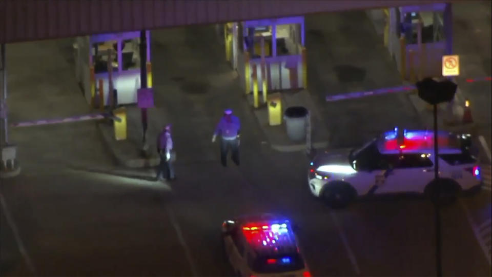 FILE - This aerial image made from video provided by WPVI TV shows police cars and officers around a Philadelphia International Airport parking garage in Philadelphia, on Oct. 12, 2023. Authorities plan to announce more arrests Wednesday, Oc. 18, 2023, in an airport parking garage shooting that killed a Philadelphia police officer and wounded another last week. Police on Monday said at least two other suspects were being sought as they announced the arrest of Yobranny Martinez Fernandez, 18, of Camden County before dawn in Cherry Hill, New Jersey. He was being held in that state on a fugitive warrant. (WPVI-TV via AP)