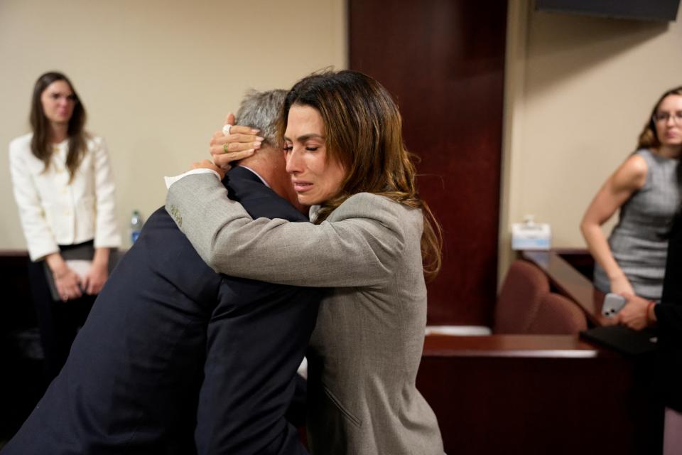 Alec Baldwin and his wife, Hilaria Baldwin, embrace in court