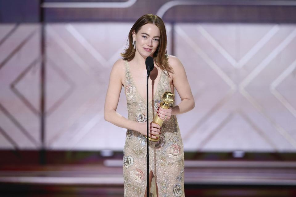 emma stone accepts the award for best performance by a female actor in a motion picture musical or comedy for 