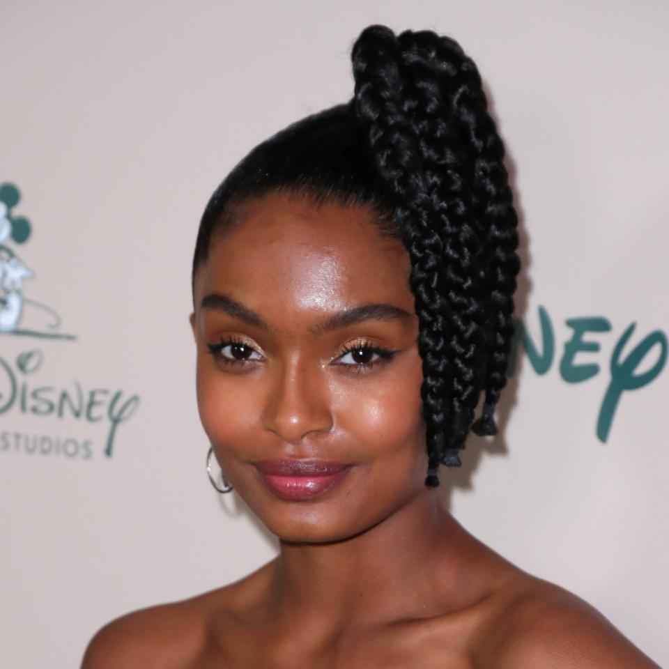 A high, side ponytail will always remind us of the '80s, but we're loving the modern twist <a href="https://www.allure.com/story/yara-shahidi-unibrow-hair-beauty-interview?mbid=synd_yahoo_rss" rel="nofollow noopener" target="_blank" data-ylk="slk:Yara Shahidi;elm:context_link;itc:0;sec:content-canvas" class="link ">Yara Shahidi</a>'s hairstylist put on the look. Instead of styling her pony with a single braid, the actor's got at least four, all tied off at the ends with a little black rubber band.