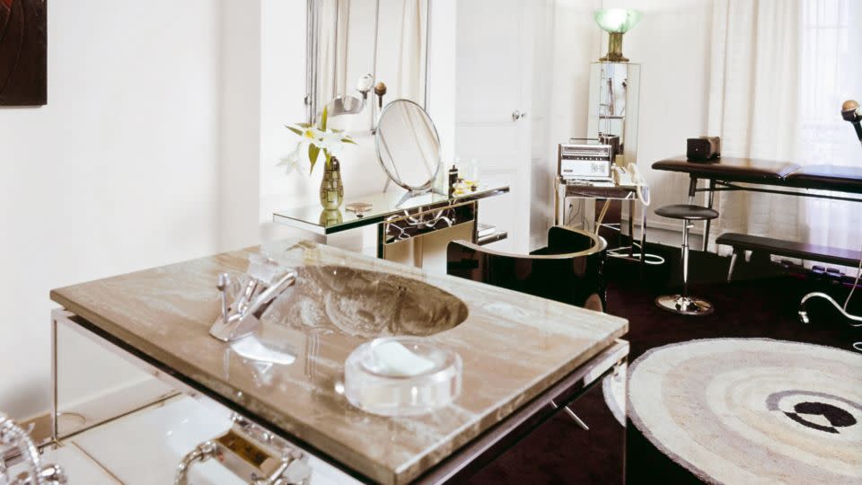 Lagerfeld designed the apartment's bathroom himself, focused on the balance of mirror and grey marble. - Horst P Horst/Condé Nast/Shutterstock/Courtesy Thames & Hudson