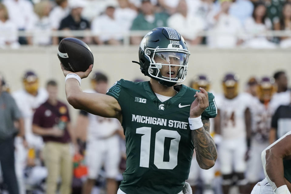 Michigan State quarterback Noah Kim passes during the first half of an NCAA college football game against the Central Michigan, Friday, Sept. 1, 2023, in East Lansing, Mich. (AP Photo/Carlos Osorio)