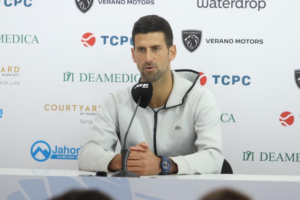 Novak Djokovic speaks to reporters.