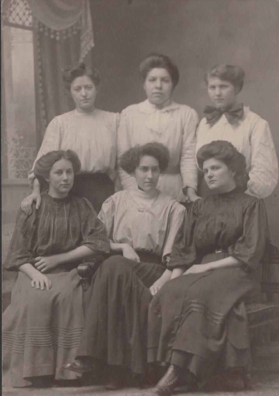 Wadsworth match factory workers take a studio portrait in the early 20th century. The girl at bottom right appears to be Minnie Berndt.