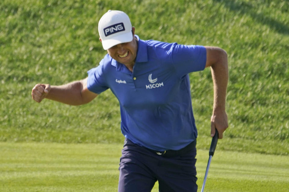 Harris English celebrates a birdie on the 18th green during the final round of the Travelers Championship golf tournament at TPC River Highlands, Sunday, June 27, 2021, in Cromwell, Conn. (AP Photo/John Minchillo)