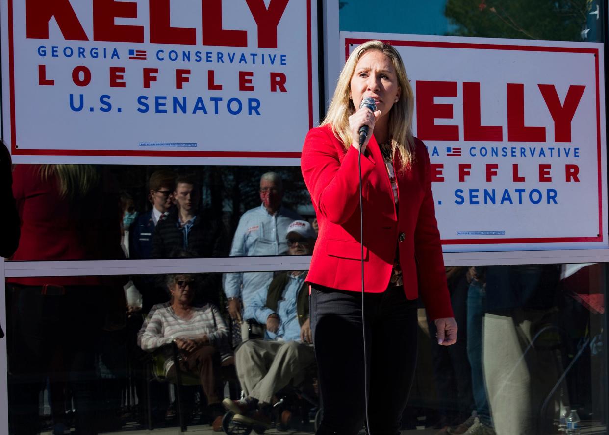 <p>Incoming congresswoman Marjorie Taylor Green, campaigning for Georgia Senator Kelly Loeffler in Georgia on 18 December, says she will reject electoral college votes for Joe Biden.</p> (AP)