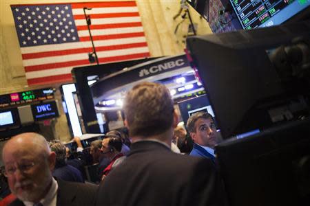 Traders work on the floor of the New York Stock Exchange after the opening bell October 9, 2013. REUTERS/Adrees Latif