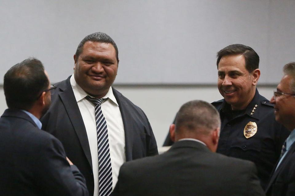 From left, Las Cruces City Manager Ifo Pili and Las Cruces Police Chief Miguel Dominguez chat in a group after the State of the City Address on March 2, 2022. Noticeably absent from the address was a mention of crime.