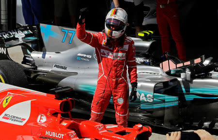 Formula One F1 - Brazilian Grand Prix 2017 - Sao Paulo, Brazil - November 12, 2017 Ferrari's Sebastian Vettel celebrates winning the race REUTERS/Paulo Whitaker