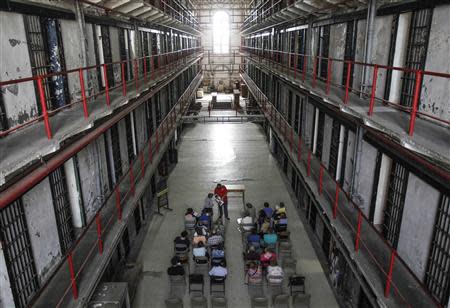 Visitors to the Missouri State Penitentiary learn about the history of the prison during a tour in Jefferson City