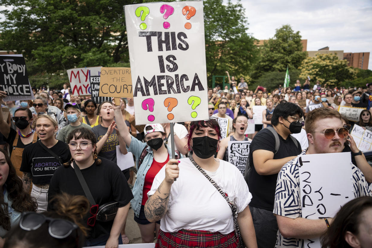 FILE - Ren Wischmann, 23, of Carver, holds a sign while chanting during a University of Minnesota student led protest in Minneapolis, Minn., after the Supreme Court overruled Roe v. Wade on June 24, 2022. Democrats and their aligned groups raised more than $80 million in the week after the Supreme Court stripped away a woman’s constitutional right to have an abortion. The flood of cash offers one of the first tangible signs of how the ruling may energize voters. (Renee Jones Schneider/Star Tribune via AP)