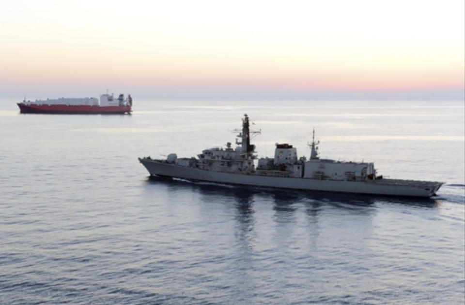 In this image from file video provided by UK Ministry of Defence, British navy vessel HMS Montrose escorts another ship during a mission to remove chemical weapons from Syria at sea off coast of Cyprus in February 2014. The British Navy said it intercepted an attempt on Thursday, July 11, 2019, by three Iranian paramilitary vessels to impede the passage of a British commercial vessel just days after Iran’s president warned of repercussions for the seizure of its own supertanker. A U.K. government statement said Iranian vessels only turned away after receiving “verbal warnings” from the HMS Montrose accompanying the commercial ship through the narrow Strait of Hormuz. (UK Ministry of Defence via AP)