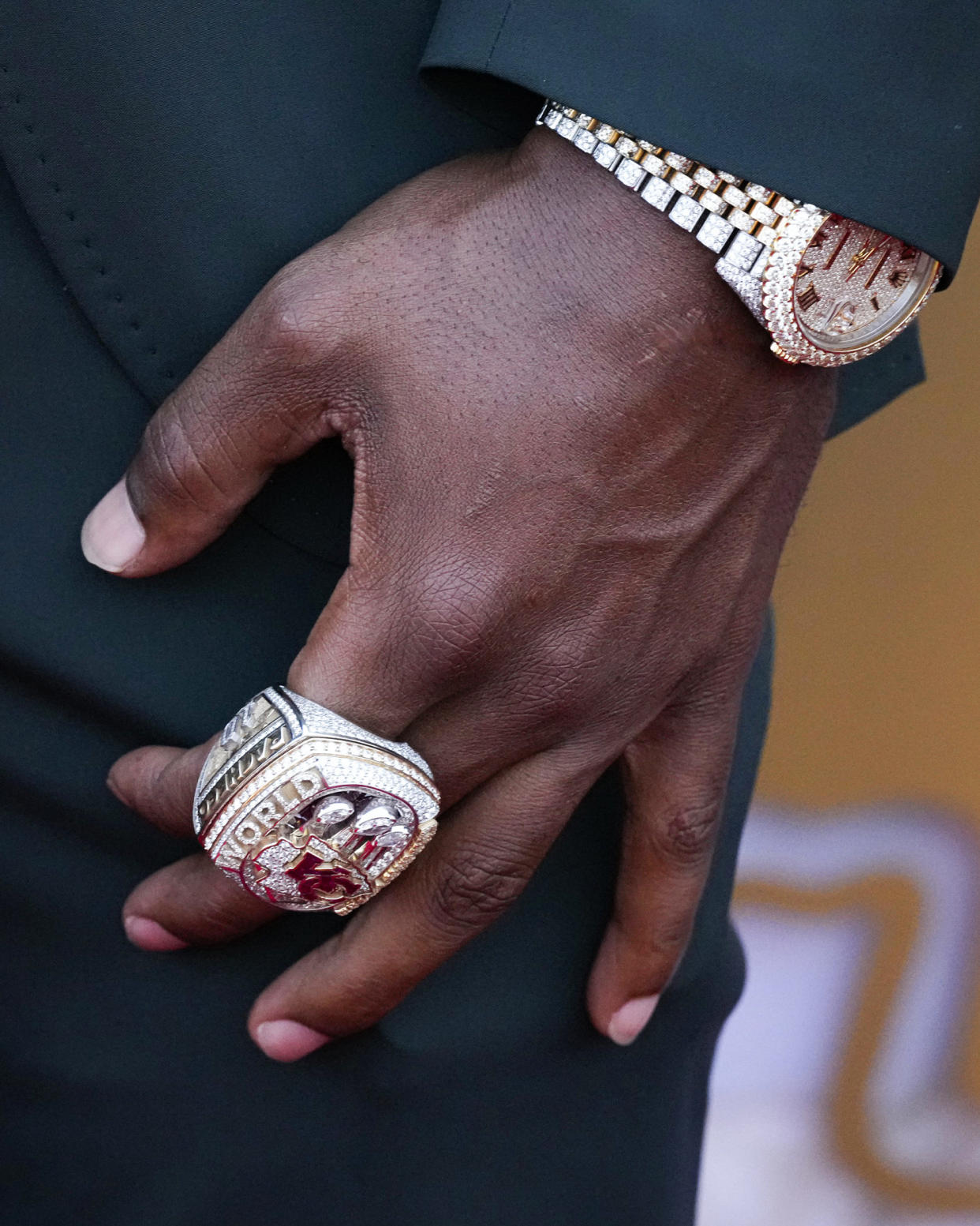 The hand with rings of Kansas City Chiefs running back Isiah Pacheco. (Charlie Riedel / AP)