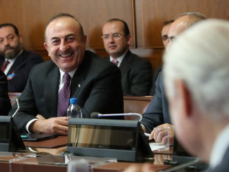 United Nations Special Envoy for Syria Staffan de Mistura (R) attends a meeting with Turkish Foreign Minister Mevlut Cavusoglu on forming a constitutional committee in Syria at the United Nations in Geneva, Switzerland, December 18, 2018. REUTERS/Denis Balibouse