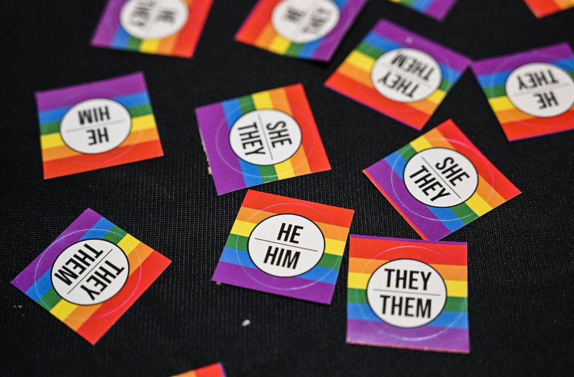 Pronoun stickers are laid out for students and staff in the Academic Center at Clovis Community College in Clovis following a ceremony to recognize June as Pride Month at the campus on Thursday, June 1, 2023. CRAIG KOHLRUSS/ckohlruss@fresnobee.com