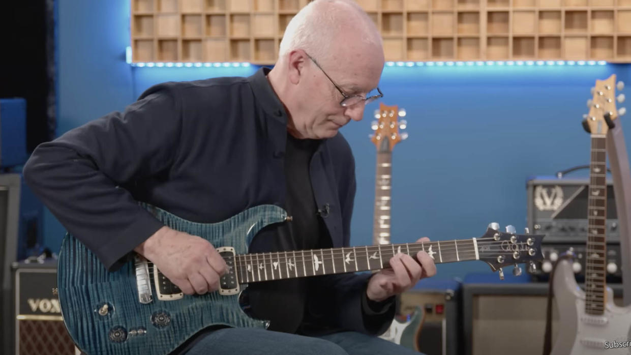  Paul Reed Smith playing a guitar. 