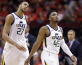 Utah Jazz guard Donovan Mitchell (45) and center Rudy Gobert look at the scoreboard during a timeout during the second half of Game 1 of an NBA basketball first-round playoff series against the Houston Rockets, Sunday, April 14, 2019, in Houston. Houston won the game 122-90. (AP Photo/Eric Christian Smith)