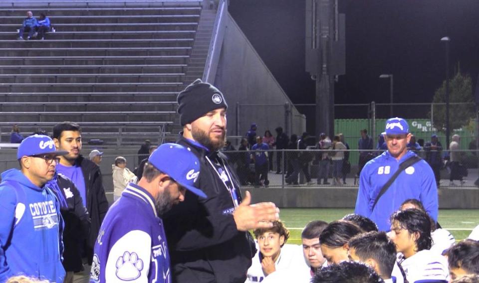 Kenny Paolinelli talks to his team after Madera defeated Garza 28-27 on Friday, Oct. 27, 2023.