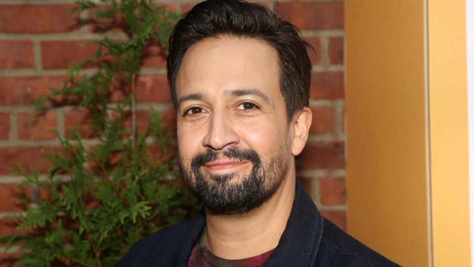 lin manuel miranda smiling for a photograph at a film screening