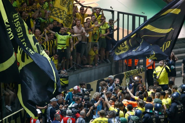 Dortmund's players and fans celebrate after their German Cup final against Eintracht Frankfurt at the Olympic stadium in Berlin on May 27, 2017