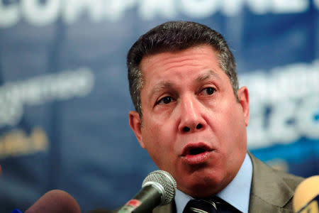 Venezuelan presidential candidate Henri Falcon talks to the media during a news conference in Caracas, Venezuela March 16, 2018. REUTERS/Marco Bello