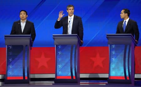 Former Rep. Beto O'Rourke speaks as entrepreneur Andrew Yang and former Housing Secretary Julian Castro listen during the 2020 Democratic U.S. presidential debate in Houston