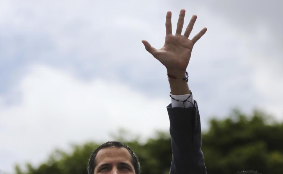 Opposition leader Juan Guaidó greets supporters as he arrives to lead a rally in Caracas, Venezuela, Saturday, May 11, 2019. Guaidó has called for nationwide marches protesting the Maduro government, demanding new elections and the release of jailed opposition lawmakers. (AP Photo/Rodrigo Abd)