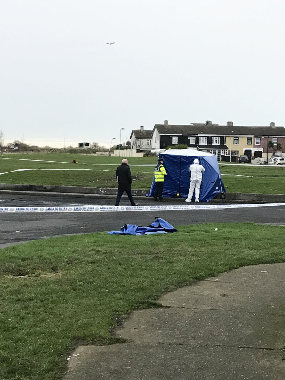 Gardai at a scene in Coolock, north Dublin, where human body parts where found in a bag. PA Photo. Picture date: Tuesday January 14, 2020. The alarm was raised shortly before 10pm when human limbs were found in a bag outside houses at the junction of Moatview Gardens and Moatview Drive in Coolock. See PA story POLICE Body Ireland. Photo credit should read: Cate McCurry/PA Wire  