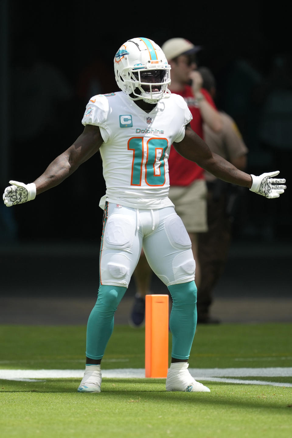 Miami Dolphins wide receiver Tyreek Hill (10) enter the field before an NFL football game against the New England Patriots, Sunday, Sept. 11, 2022, in Miami Gardens, Fla. (AP Photo/Rebecca Blackwell)